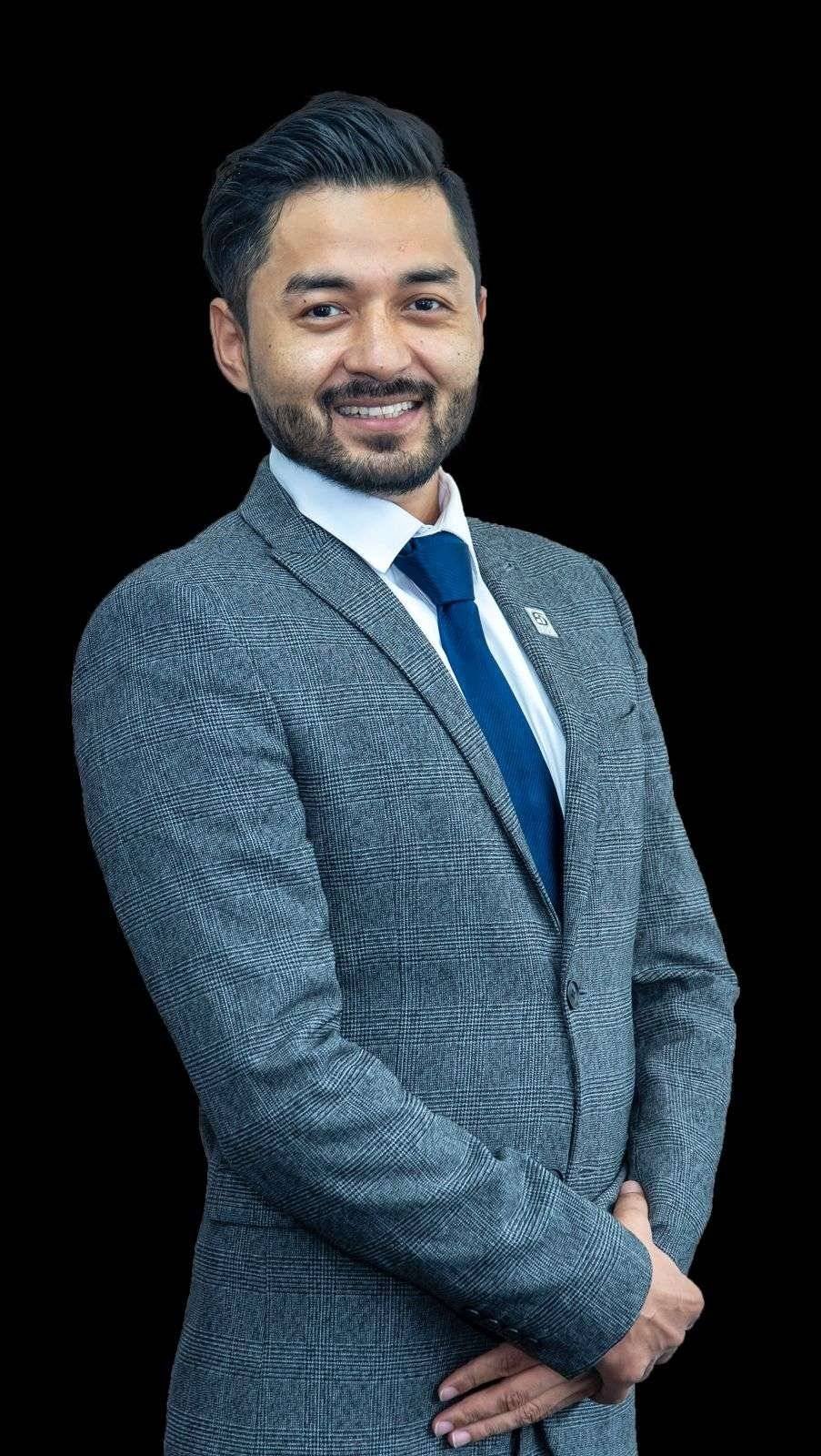 Man in gray suit with blue tie